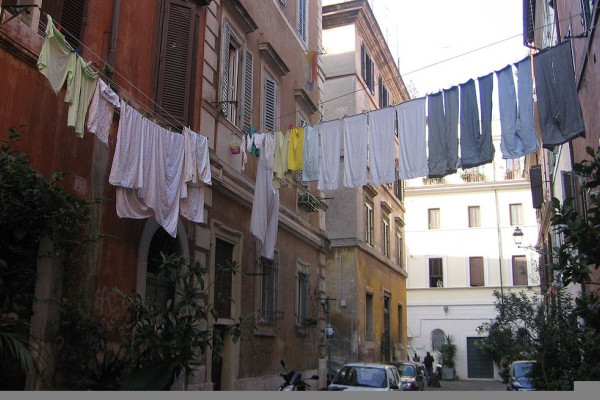 Laundry is hung to dry above an Italian street.