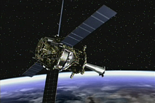 Artist concept of Gravity Probe B spacecraft in orbit around the Earth.