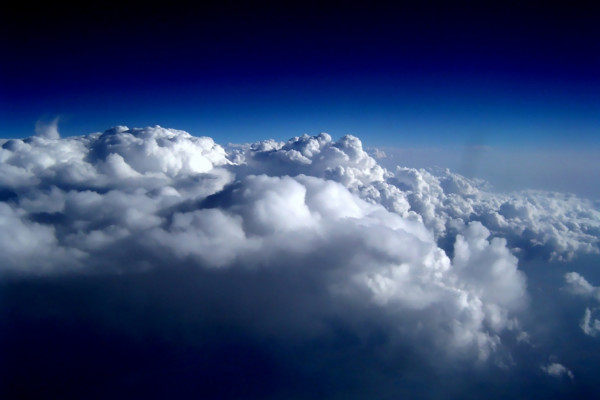 A color-enhanced version of an aerial photograph of Stratocumulus perlucidus clouds; taken from the rear seat of a Northwest Airlines Airbus A320 flying over the midwestern United States, en route from Los Angeles, CA to Minneapolis/St. Paul, MN.