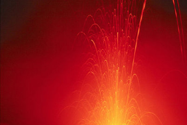 Eruption of Stromboli (Isole Eolie/Italia), ca. 100m (300ft) vertically. Exposure of several seconds. The dashed trajectories are the result of lava pieces with a bright hot side and a cool dark side rotating in mid-air.