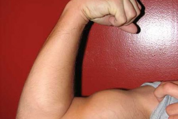 Man flexing arm