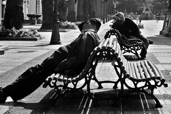 A couple of guys sleeping near the Kiosko Alfonso in A Coruña (Galicia, España.)