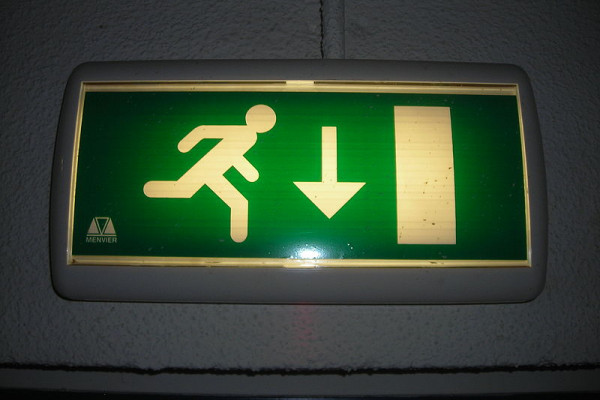 Emergency light with an emergency exit pictogram