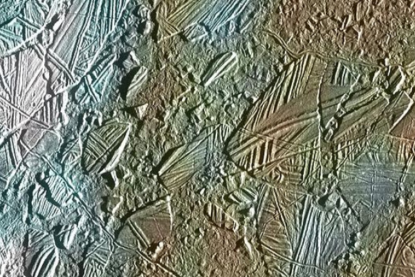 View of a small region of the thin, disrupted, ice crust in the Conamara region of Jupiter's moon Europa showing the interplay of surface color with ice structures. The white and blue colors outline areas that have been blanketed by a fine dust of ice.