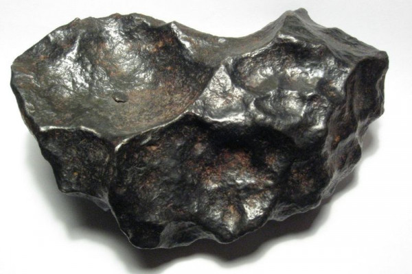 A 4.5kg individual meteorite from the Gibeon meteorite field. Gibeon is a fine octahedrite, class IVA. This specimen is about 19cm wide.