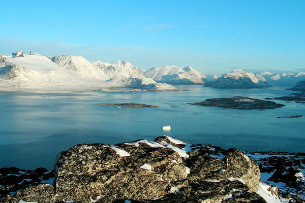 Scenery from Ravnefjeldet, Nanortalik (Southernmost part of Greenland) on a clear December morning. The jagged mountains in background (left) are the 1300m high 'Savtakkerne'.