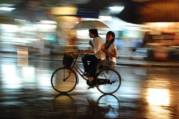 Cycling through Hanoi in the rain.