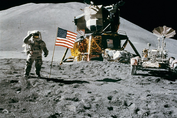  Apollo 15 Lunar Module Pilot James Irwin salutes the U.S. flag. Astronaut James B. Irwin, lunar module pilot, gives a military salute while standing beside the deployed U.S. flag during the Apollo 15 lunar surface extravehicular activity (EVA) at the...