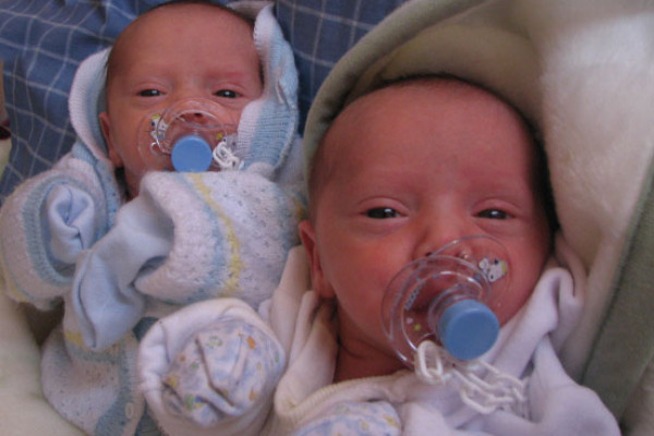 Baby identical twins - they may share the same genes, but which ones are active?