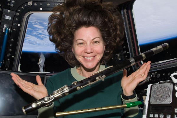 NASA's Cady Coleman playing the flute in space