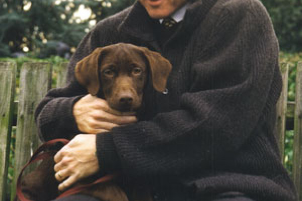 Persident Bill Clinton getting acquainted with Buddy on the South Lawn, December 5, 1997.