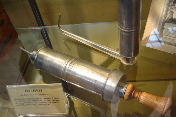 Some clyster (enema) syringes, the one in the back has a nozzle designed for self-administration.