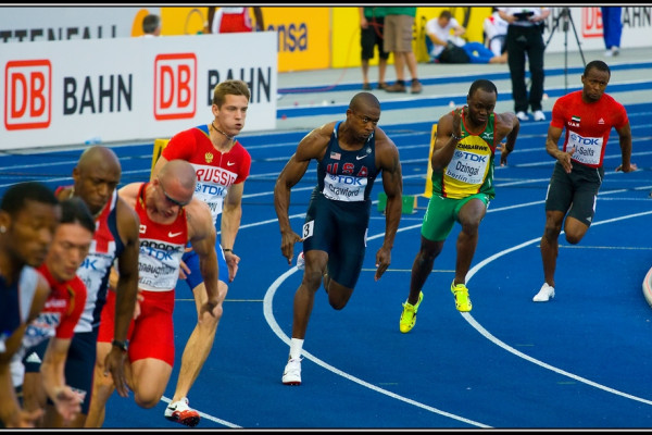 Athletes turning the first bend of the 200 m