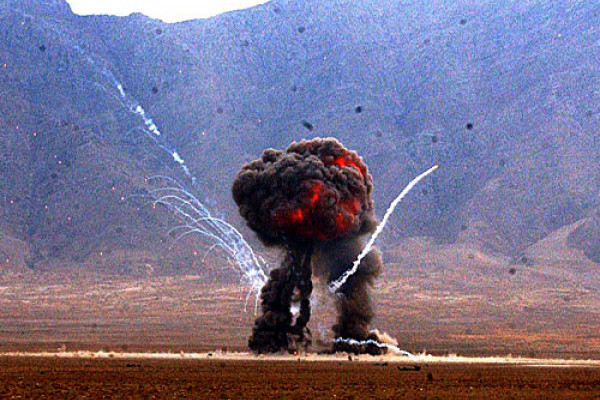 A weapons cache is detonated at the East River Range on Bagram Airfield, Afghanistan, Dec. 2, 2004. The cache was destroyed by airmen of the U.S. Air Force's 455th Explosive Ordnance Group.
