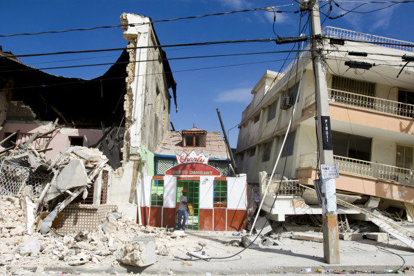 A man exits a restaurant after he looked for his belongings. An earthquake rocked Port au Prince on January 12, 2010.