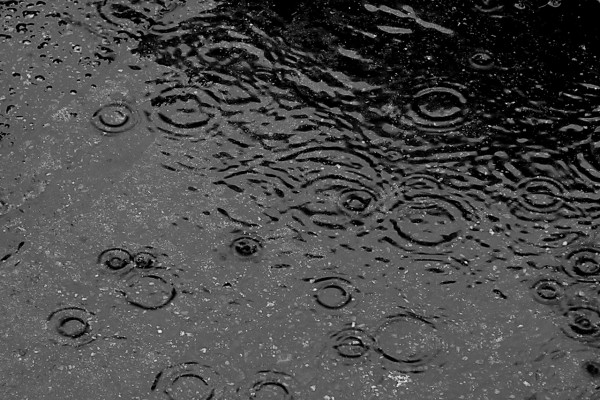 Raindrops falling on water