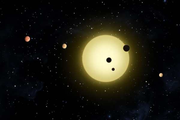 Kepler-11 is a sun-like star around which six planets orbit. At times, two or more planets pass in front of the star at once, as shown in this artist's conception of a simultaneous transit of three planets observed by NASA's Kepler spacecraft on Aug. 26