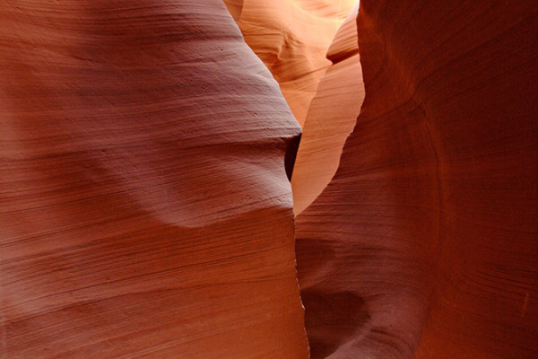 Inside Lower Antelope Canyon, featuring red sandstone corridors.