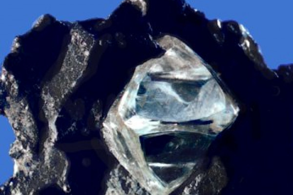 A slightly misshapen octahedral diamond crystal in matrix.