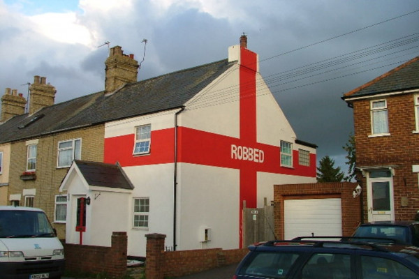 We wuz robbed. I understand that this house was painted this way after England lost to Portugal 6-5 on penalties in Euro 2004, in controversial circumstances.