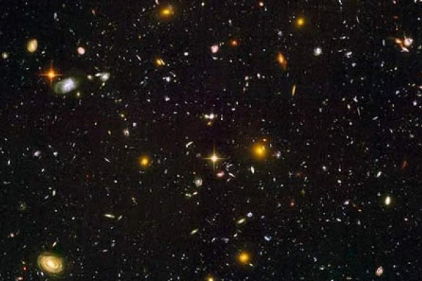 Figure 4: Hubble Ultra Deep Field. Recently, astronomers using the Hubble unveiled the deepest look into the universe yet, showing what could be the most distant and the youngest galaxies ever seen.