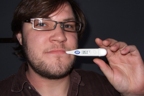 Ben with the thermometer in his mouth in the same place as the mint. A man born to smoke the pipe, but he doesn't smoke.