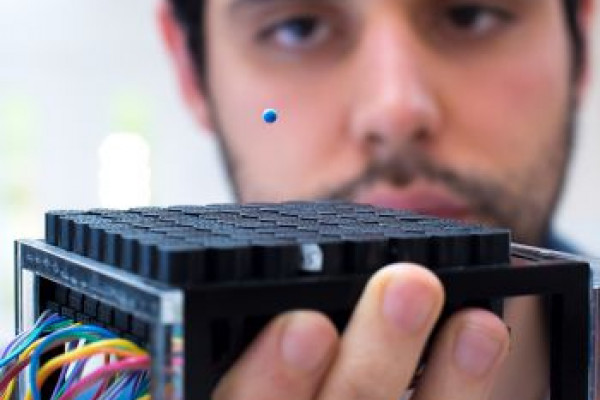 Lead author Asier Marzo levitating a polystyrene ball using soundwaves.