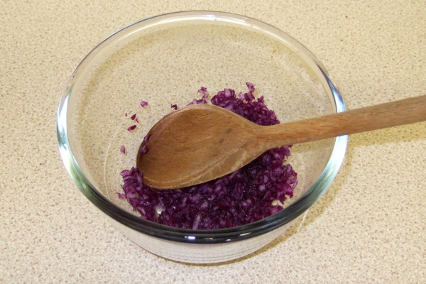 Crushing the red cabbage with a little water