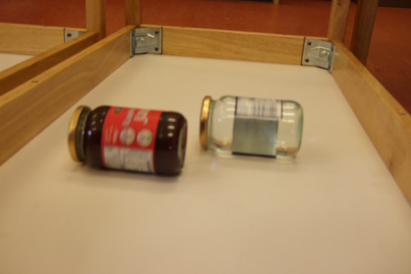A race between jam and water filled jars
