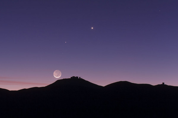 The crescent Moon and earthshine over ESO's Paranal Observatory.