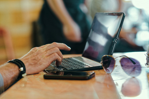 Person using a laptop at a table