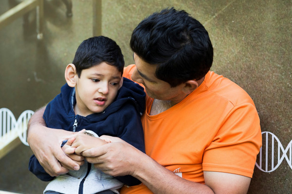 Kushagra Singha, a child with FOXG1 Syndrome, with his father Vivek.