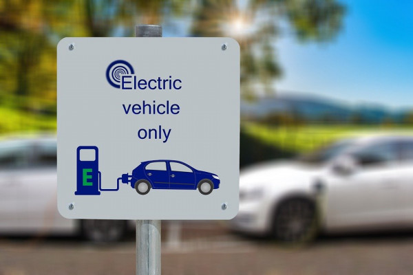 A sign for an electric vehicle charging station.