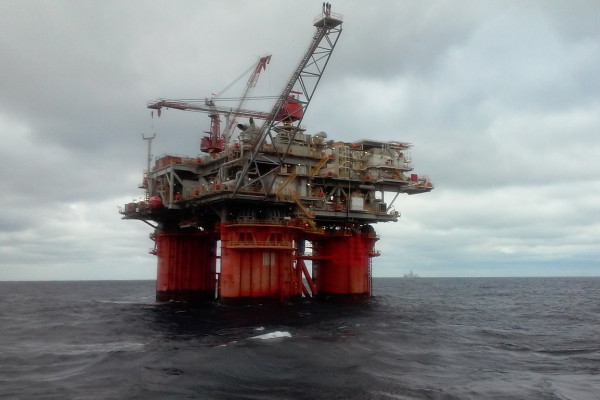An oil rig in the ocean.