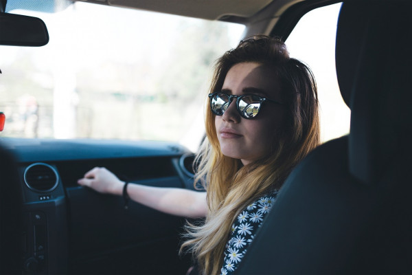 female passenger in car