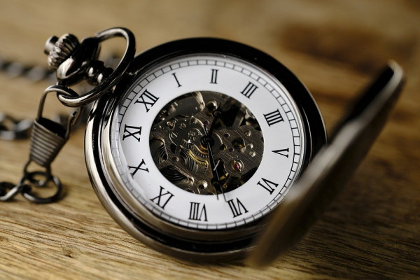 A close up of an open pocket watch