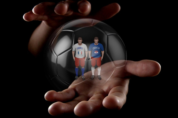 Foutball players in a see-through ball