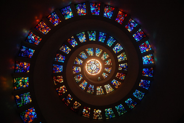 A spiral made of different stained glass windows