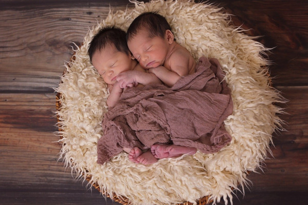Two twin babies sleeping.