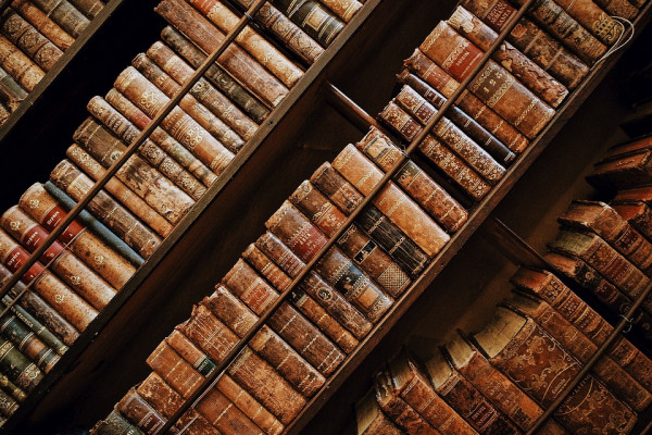 Old books packed on bookshelves