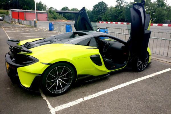 McLaren 600LT Spider parked on a racetrack with the doors open