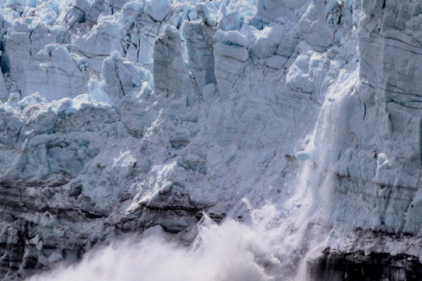 Ice breaking off a large ice shelf.