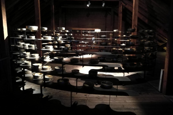 The mezzanine level of the Longplayer lighthouse, containing a display of brass singing bowls.