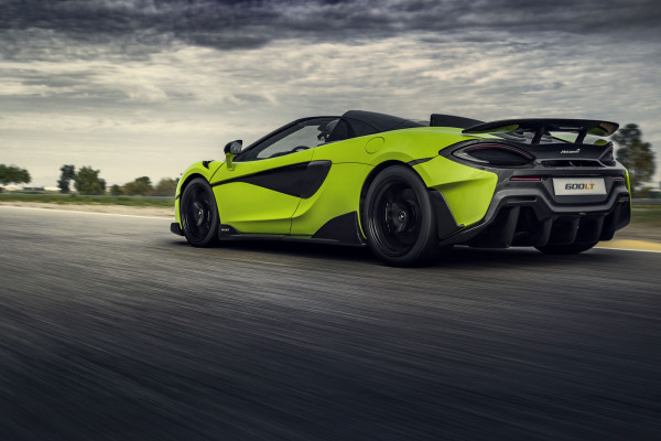 Lime-green McLaren 600LT Spider driving on road