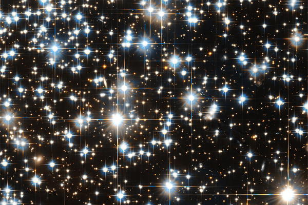 Hubble Telescope image of distant stars showing diffraction artefacts.