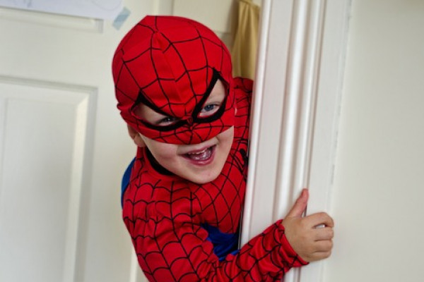 Boy dressed in a spiderman costume