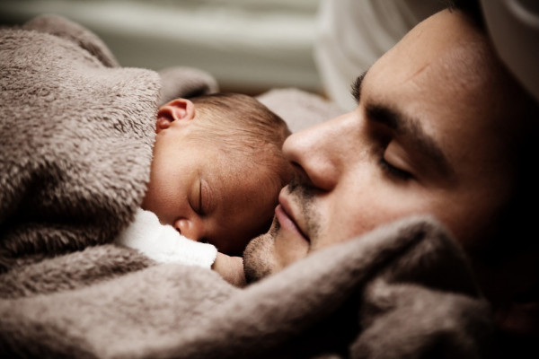 Sleeping father and baby