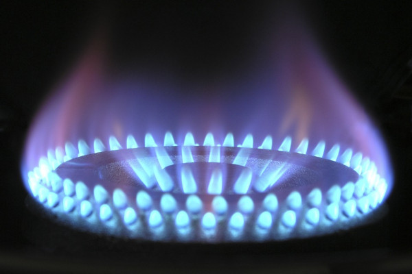 A Close up of a lit gas burner cooker