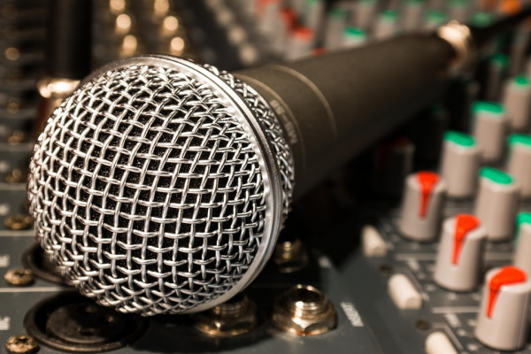 A microphone and mixing desk