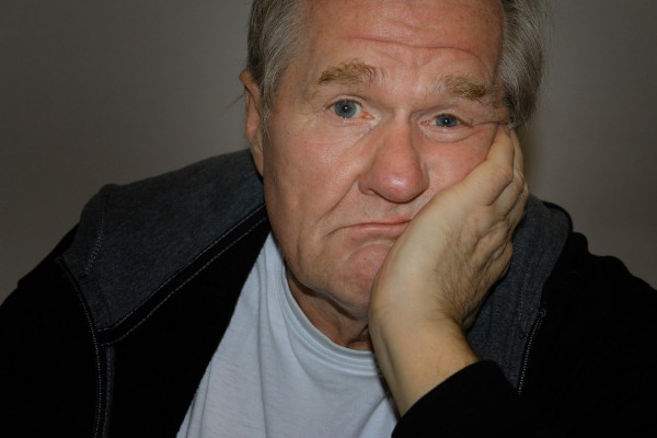 photo of a man looking bored